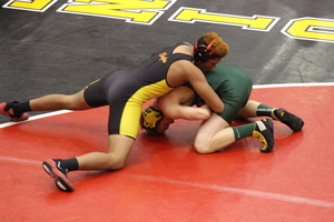 Wrestlers Take Opponents to the Mat