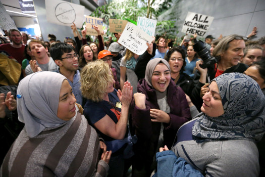 From left, Khaleah Tahan, of Daly City, Kerry McCracken, of Oakland, Bayan Tahan, of Daly City and her mother Rawa Alchalian, of Daly City, protest with hundreds of other people against the detention of Muslim refugees at San Francisco International Airport in San Francisco, Calif., on Saturday, Jan. 28, 2017. Tahan has family from Syria, they said. U.S. President Donald Trump signed an executive action prohibiting Muslims from entering into the United States. (Ray Chavez/Bay Area News Group)