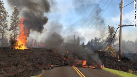 Lava flowing onto a public road.