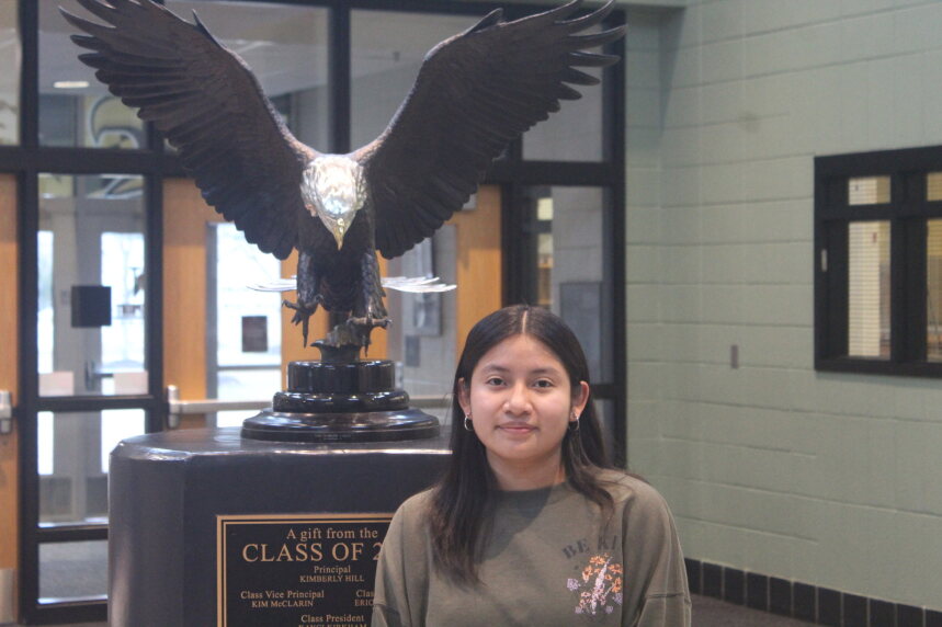 Daniela stands with the iconic eagle statue.