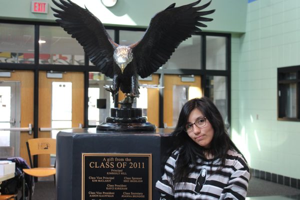Clarissa strikes a pose next to the lobbys eagle statue.