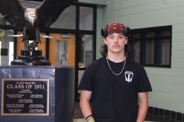 Tre poses seriously with the Eagle in the lobby.