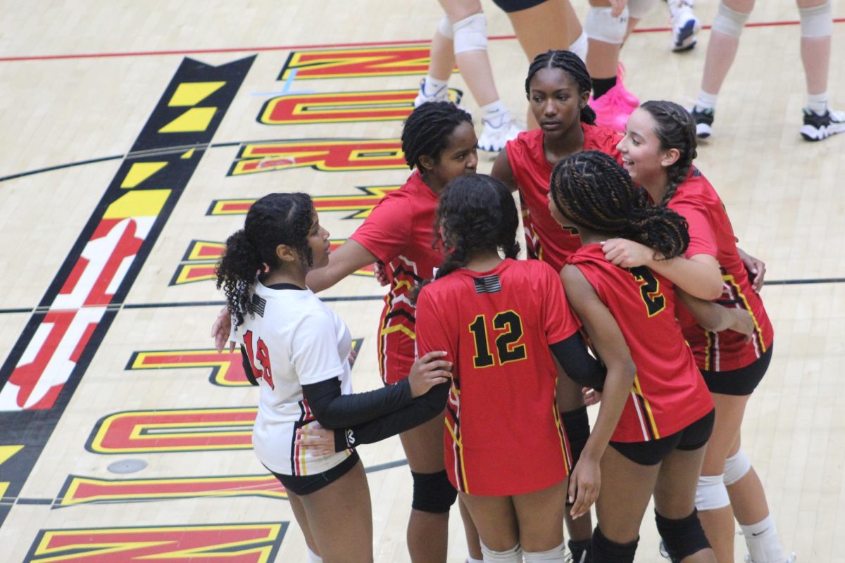 The team celebrates the point.